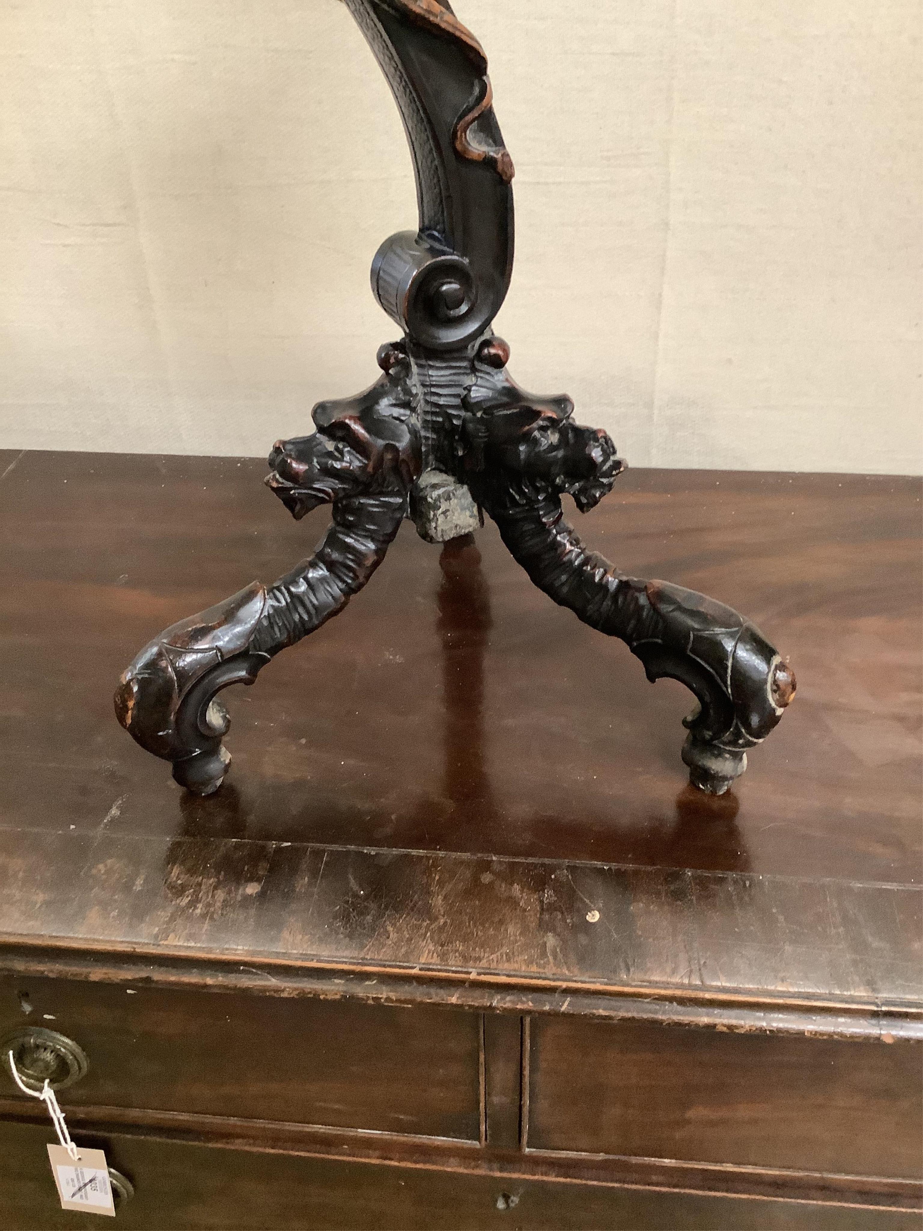 An Italian carved walnut cherub and shell torchere, height 81cm. Condition - good